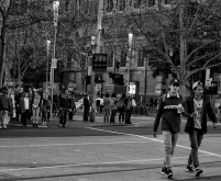 Two boys crossing Flinders St